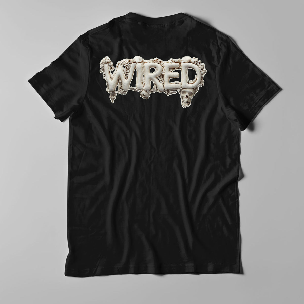 Wired &#39;BONES&#39; T-Shirt featuring skeleton-inspired artwork on black cotton fabric.