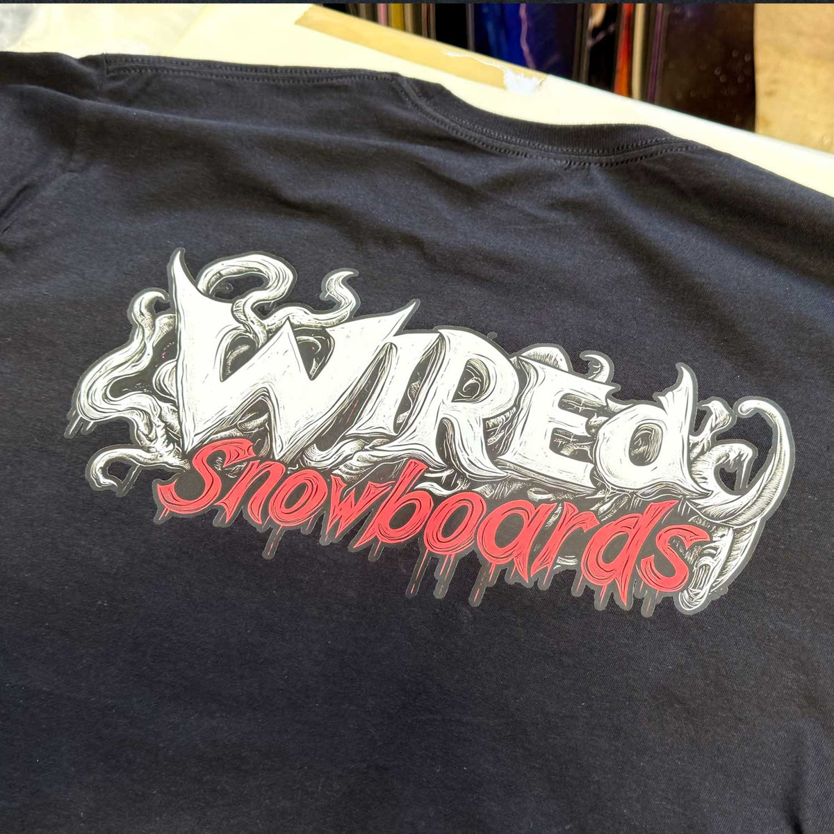Wired &#39;DOODLE&#39; T-Shirt showcasing hand-drawn logo design on black cotton fabric.